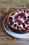 Homemade Ricotta Plum Cake on wooden table. Cottage cheese casserole