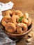 Homemade rosquillas, traditional anise donuts from Spain, typically eaten in Easter, on a rustic wooden table, copy space. Still