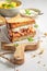 Homemade sandwich with chicken, exotic fruits and herbs