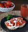 Homemade sandwich with sliced tomato,eggs and tomato smoothie