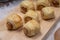 Homemade sausage rolls on a wooden plate, mini sausage rolls on wooden plate.