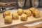 Homemade sausage rolls on a wooden plate, mini sausage rolls on wooden plate.