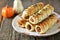 Homemade sausages in puff pastry on wooden background.