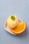 Homemade scoop of orange sorbet from above