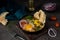 Homemade shakshuka with vegetables on a dark background