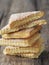 Homemade shortbread puff pastry Triangle on a wooden ancient rustic background. Side view. Place for text