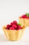 Homemade shortcrust raspberry pastry. Summer berries mini tartlets with vanilla custard and mint leaves. Fresh desserts on the