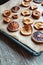 Homemade slices of dried apples and oranges on a baking tray