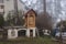 Homemade smokehouse in the morning mist. Domestic production of sausages. Smokehouse at the house in the woods