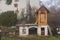 Homemade smokehouse in the morning mist. Domestic production of sausages. Smokehouse at the house in the woods