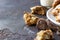 Homemade soft apple cookies on a plate with milk, dark concrete background. Dessert or breakfast for children, sweet snack.