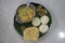 A homemade South Indian thali served on banana leaves. Rice dumplings or All are part of Italian cuisine with Appam
