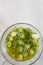 Homemade Spanish Style Pitted Green Olives Marinated in Oil with Garlic Herbs and Parsley. Top View. Mediterranean Cuisine