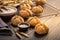 Homemade spelt bread rolls with salt on wooden background