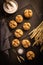 Homemade spelt bread rolls with salt on wooden background