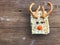 Homemade square bars of Rice Crispy Decorate Christmas reindeer on the wooden table