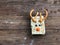 Homemade square bars of Rice Crispy Decorate Christmas reindeer on the wooden table