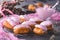 Homemade strawberry eclairs with pink cream on the grey table