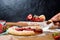 Homemade strawberry Galette with fresh ripe strawberries on a dark background, top view. cut cake, a piece of Galette on a knife