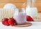 Homemade strawberry and greek yogurt face mask in a glass jar. Diy cosmetics.