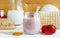 Homemade strawberry and greek yogurt face mask in a glass jar. Diy cosmetics recipe