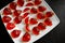 Homemade strawberry jelly or jellies on white plate