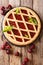 Homemade summer pastries cherry pie Crostata close-up. Vertical