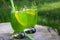 Homemade summer refreshing tarragon lemon drink on patio table