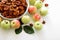 Homemade sun-dried organic apple slices crispy apple chips with fresh apple and cinnamon on white wooden background.