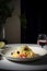 Homemade tagliatelle pasta on a plate on dark background. Italian food