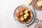 Homemade tarte tatin pie with apples and nuts on a beige background. French apple pie.