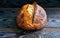 Homemade tartine bread on dark wooden table