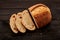 Homemade tartine bread on dark wooden table