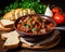 homemade tasty Hungarian goulash with beef fresh vegetables and bread.