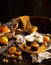 Homemade tasty sweet orange pumpkin muffins or cupcakes with white cream, lavender, zest, nuts