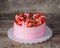 Homemade tender pink cake with strawberries