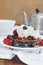 Homemade thin pancakes with whipped cream and berries