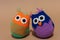 Homemade Three stuffed colorful toy owl.