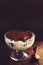 Homemade tiramisu dessert in a glass ramekin