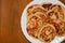 Homemade toasted sweet pancakes on a white dish