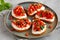 Homemade Tomato Ricotta Tartine on a Plate, side view