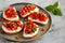 Homemade Tomato Ricotta Tartine on a Plate, side view