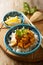 Homemade traditional chicken curry with rice with fresh herbs