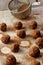 Homemade truffle balls on wooden table