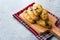 Homemade Turkish Pastry Pogaca with Cumin Seeds / Black Sesame and Cheese on Wooden Board.