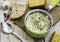 Homemade Turkish yogurt soup, red peppers and bread on the wooden background