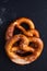 Homemade twisted knot Soft salt Pretzels on black slate board ba