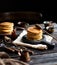 Homemade two stacks of pancakes on wooden boards with pouring honey and honey stick