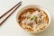Homemade udon noodles with pork in soy or shoyu soup