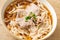 Homemade udon noodles with pork in soy or shoyu soup